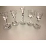 A group of five late 18th and early 19th century drinking glasses including: a cordial glass with
