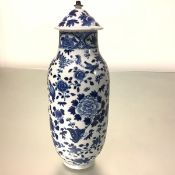 A Chinese blue and white porcelain vase and cover, of shouldered cylindrical form, the body
