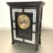 An Aesthetic Movement mantel clock, last quarter of the 19th century, the ebonised case of