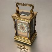 A French 19th century brass-cased carriage clock, the eight day movement striking the hour and