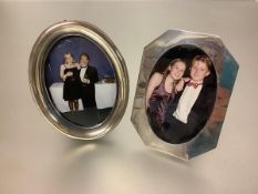 Two silver photograph frames: the first with frame of shaped ocatagonal form enclosing an oval