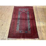 A finely woven Turkoman prayer rug, with central ivory lined mirhab within multiple indigo and