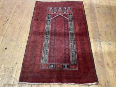 A finely woven Turkoman prayer rug, with central ivory lined mirhab within multiple indigo and