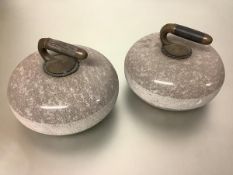 A pair of polished granite curling stones, early 20th century, of characteristic form, each
