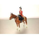 A Beswick model of H.M. The Queen mounted on Imperial at Trooping the Colour 1957, model no. 1546.