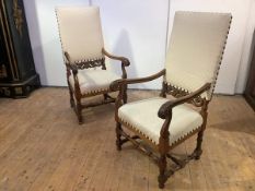 A pair of Edwardian open armchairs, in 17th century style, each square upholstered back and seat