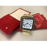 Must de Cartier a Santos bi-colour travelling alarm clock, the square white enamel dial with Roman