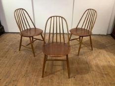 Haga H Fors, Sweden: a set of three beech and teak plywood dining chairs, 1950's, each hoop back
