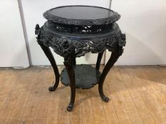 A large Japanese ebonised urn stand, late 19th century, the circular top with pierced border and