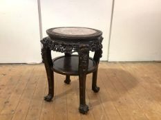 A 19th century Chinese jardiniere stand, the circular top with marble inset and foliate carved
