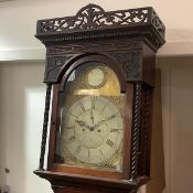 A George III mahogany longcase clock, by J. Stewart, Glasgow, the fourteen inch arched brass dial