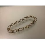 A 9ct gold ropetwist fancy chainlink bracelet, of oval links. Length 20cm, 20 grams