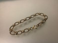 A 9ct gold ropetwist fancy chainlink bracelet, of oval links. Length 20cm, 20 grams