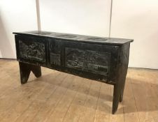 An early 18th century six-plank chest, later carved in the 19th century, with depictions of