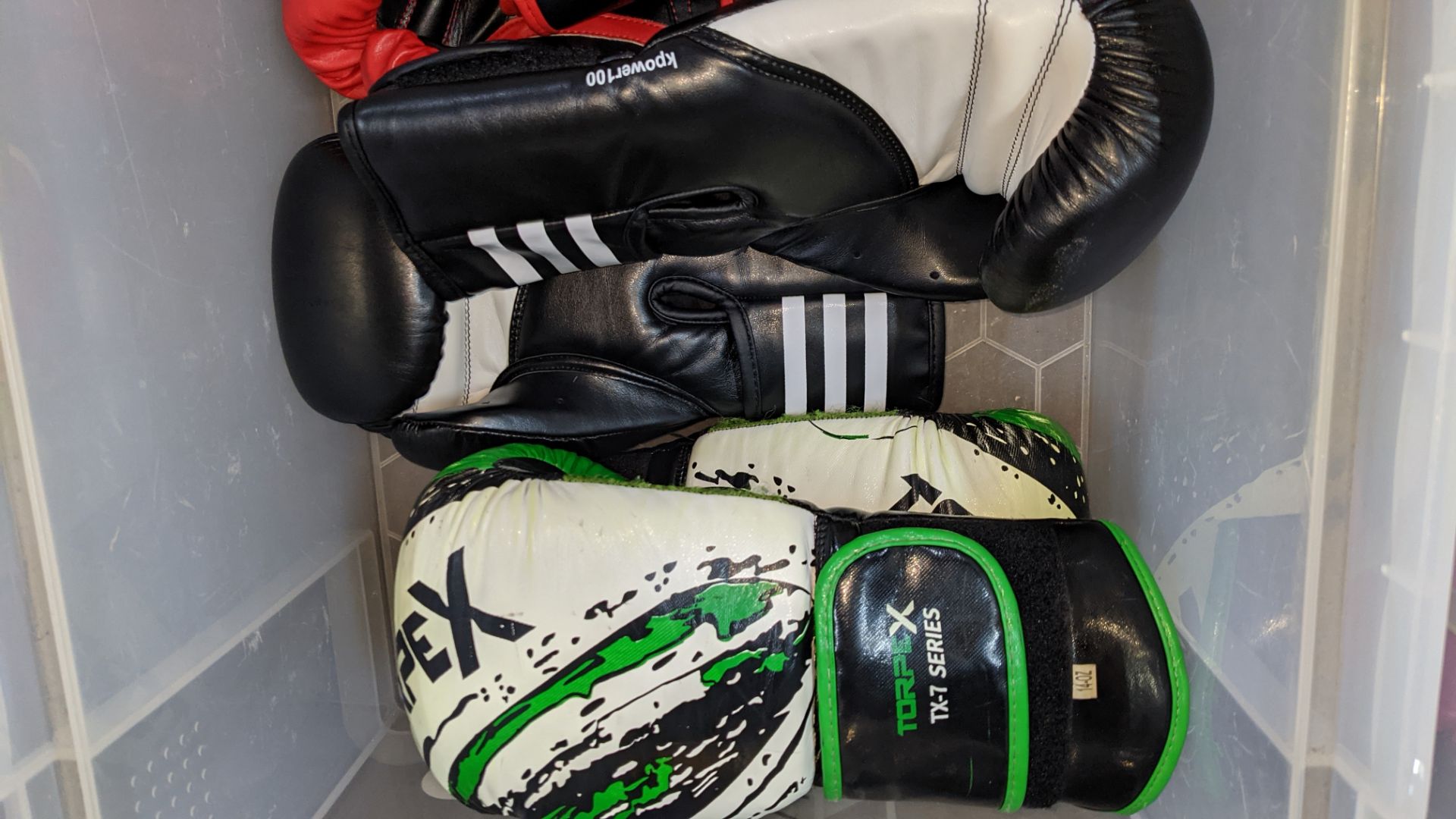 4 pairs of boxing gloves by Torpex, Fairtex, Crane & Adidas. NB please note rip to one of the Torpe - Image 9 of 10