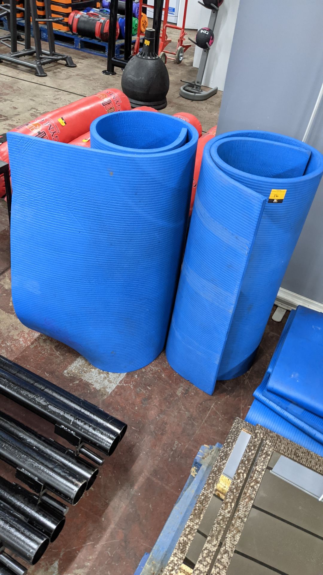 2 off blue roll up foam exercise mats, each measuring 2m x 1m