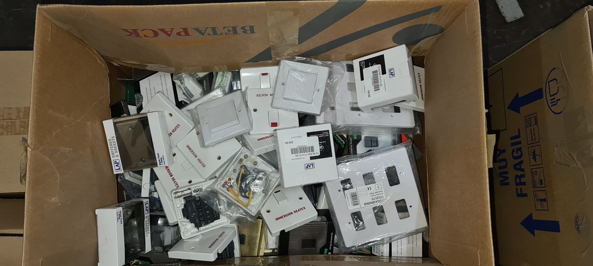 Large box of assorted switches & sockets by a variety of brands