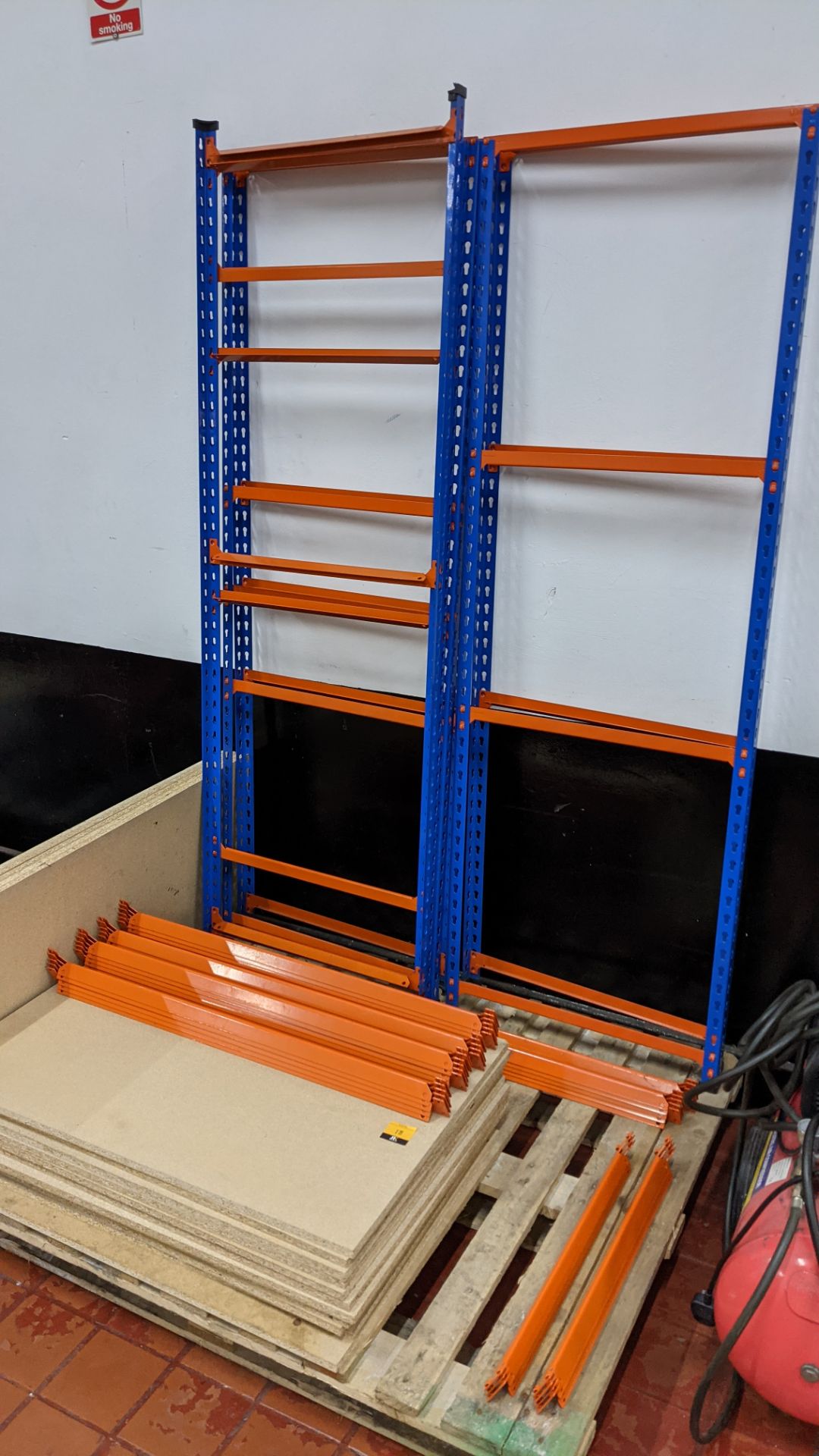 Quantity of blue & orange bolt-free racking comprising 6 uprights, approx. 16 shelves & a quantity o