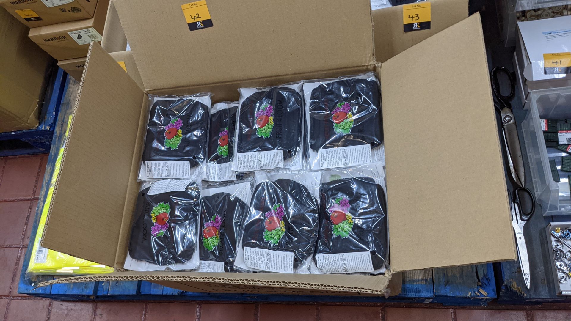 Large box of Fruit of the Loom adult face masks. The masks are 100% cotton, with 5 face masks in a p