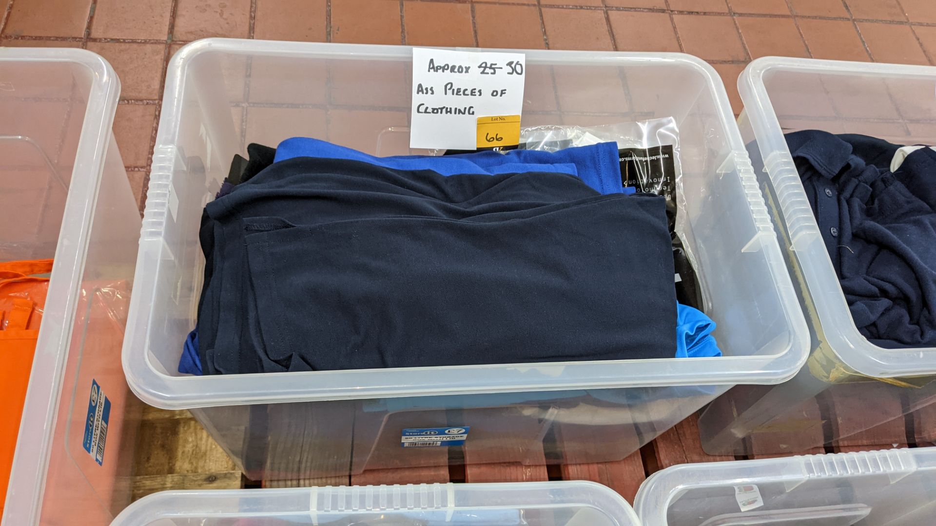 Approx. 30 assorted garments - crate excluded