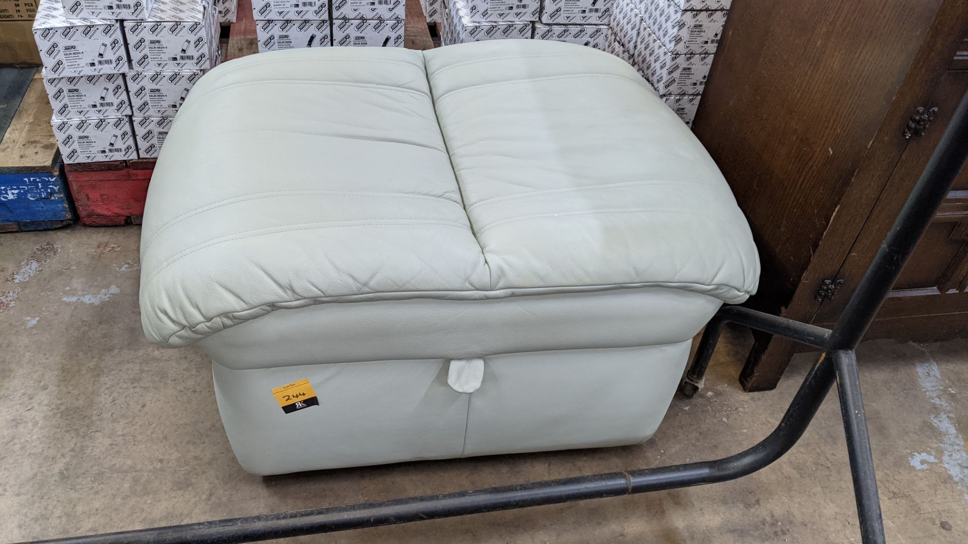 Large soft mint green leather pouffe with hinged access to large storage compartment