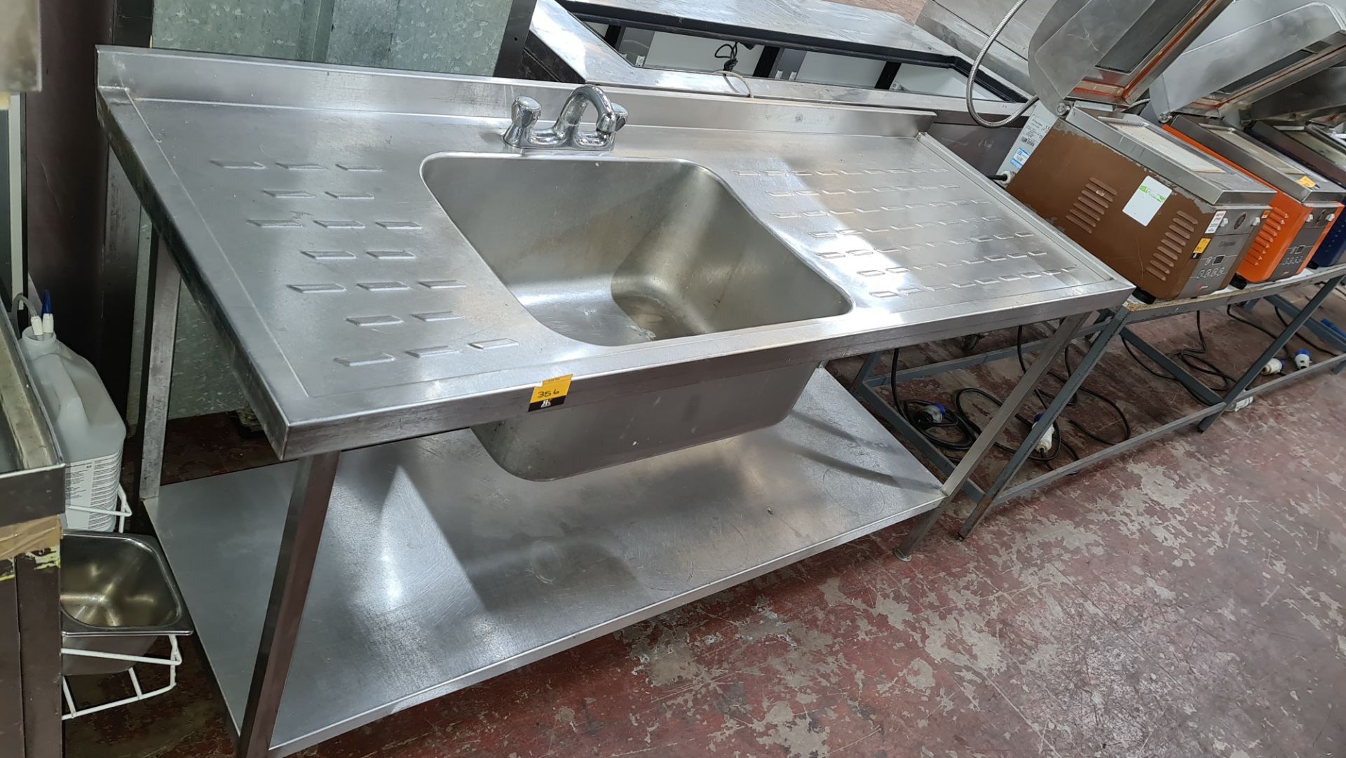 Stainless steel floor standing basin with drainers to both sides plus mixer tap. Max width approxim