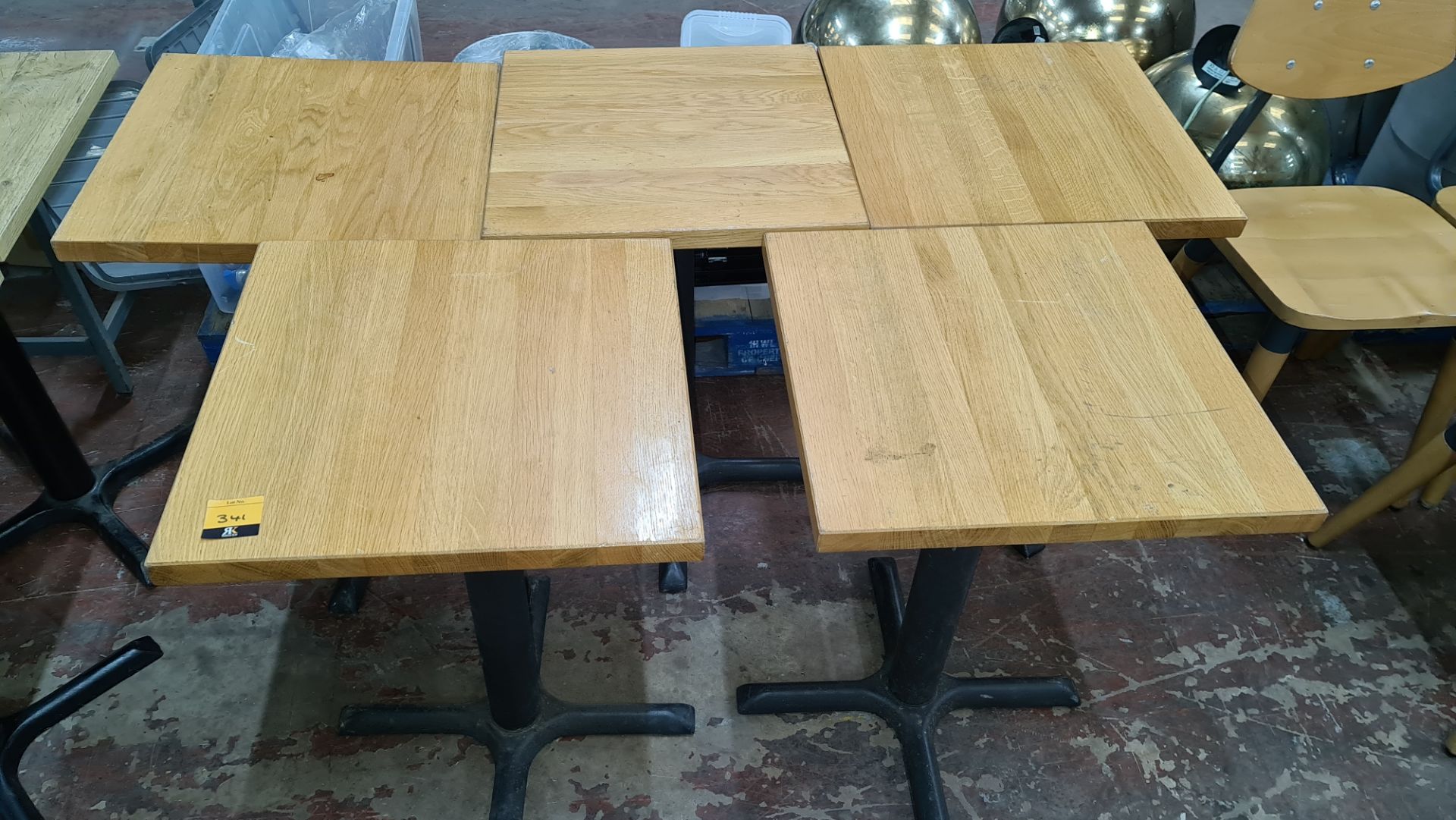 5 off matching café tables with black metal single pedestal bases & wooden tops each 510mm square