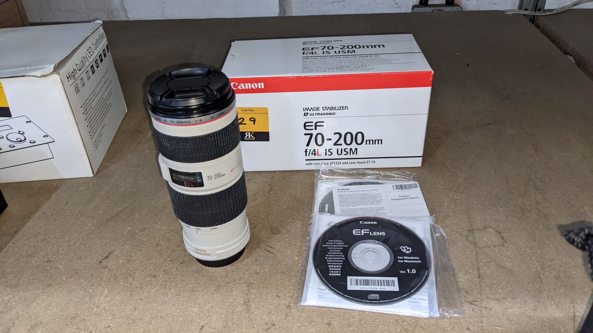 Canon EF 70-200mm lens, image stabilizer ultrasonic, F/4L IS USM. Includes box & discs as pictured