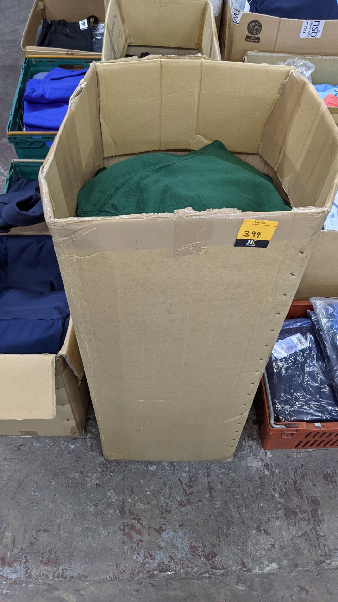 Tall box of green sweatshirts