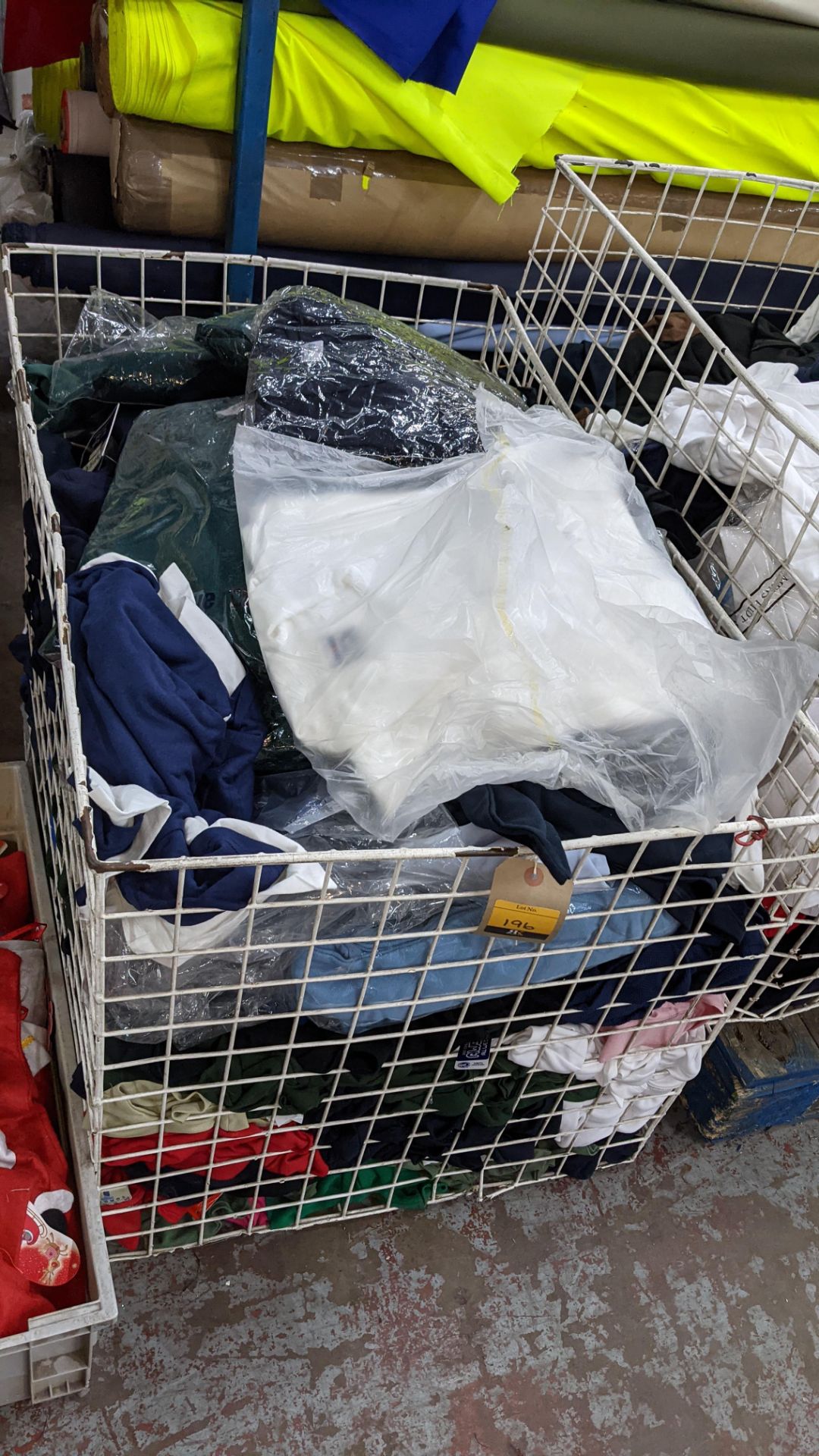 The contents of a cage of assorted adults garments. NB cage excluded