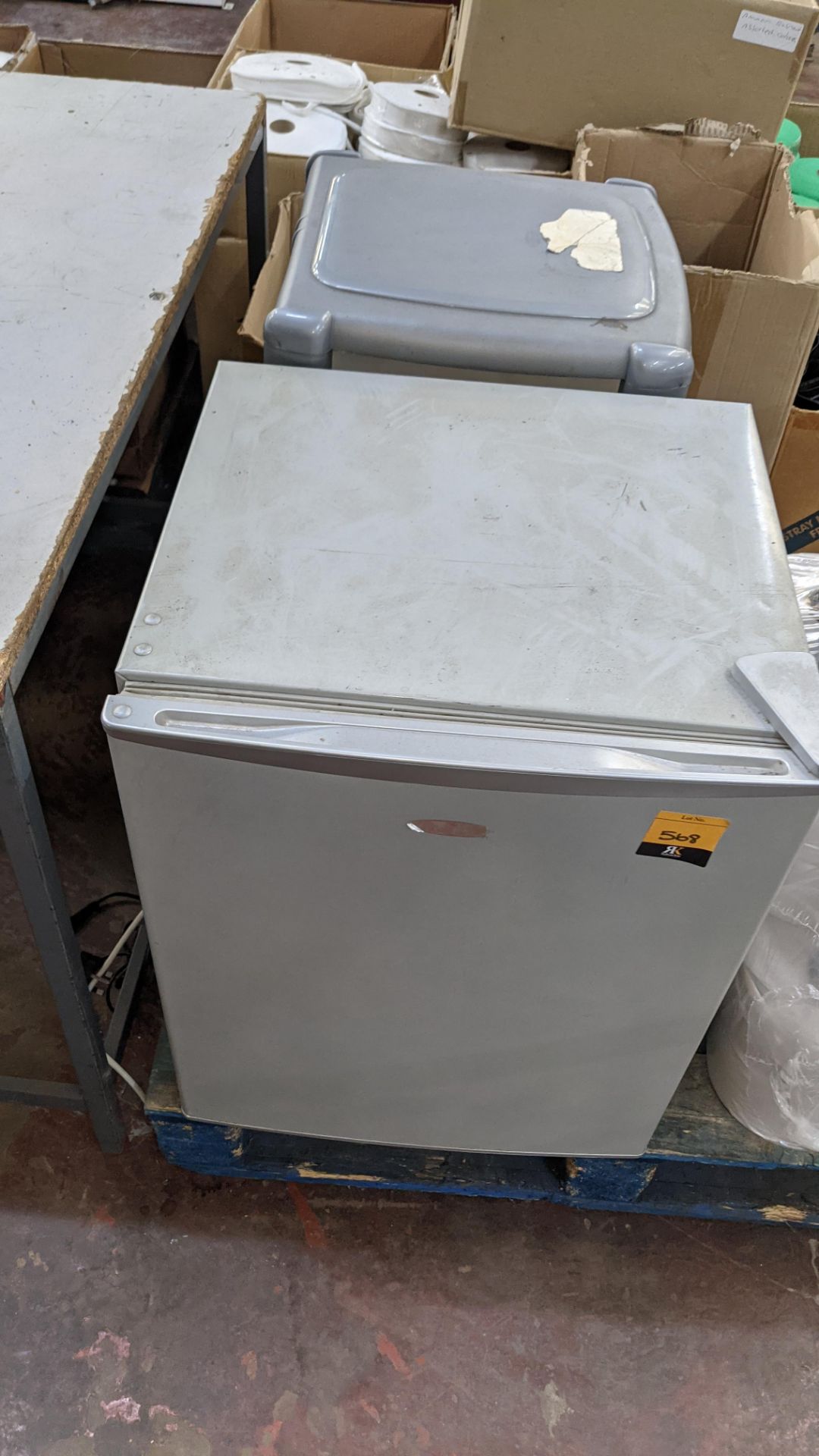 Small fridge plus plastic storage unit