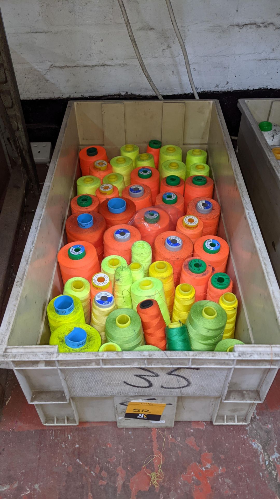 The contents of a crate of primarily fluorescent thread