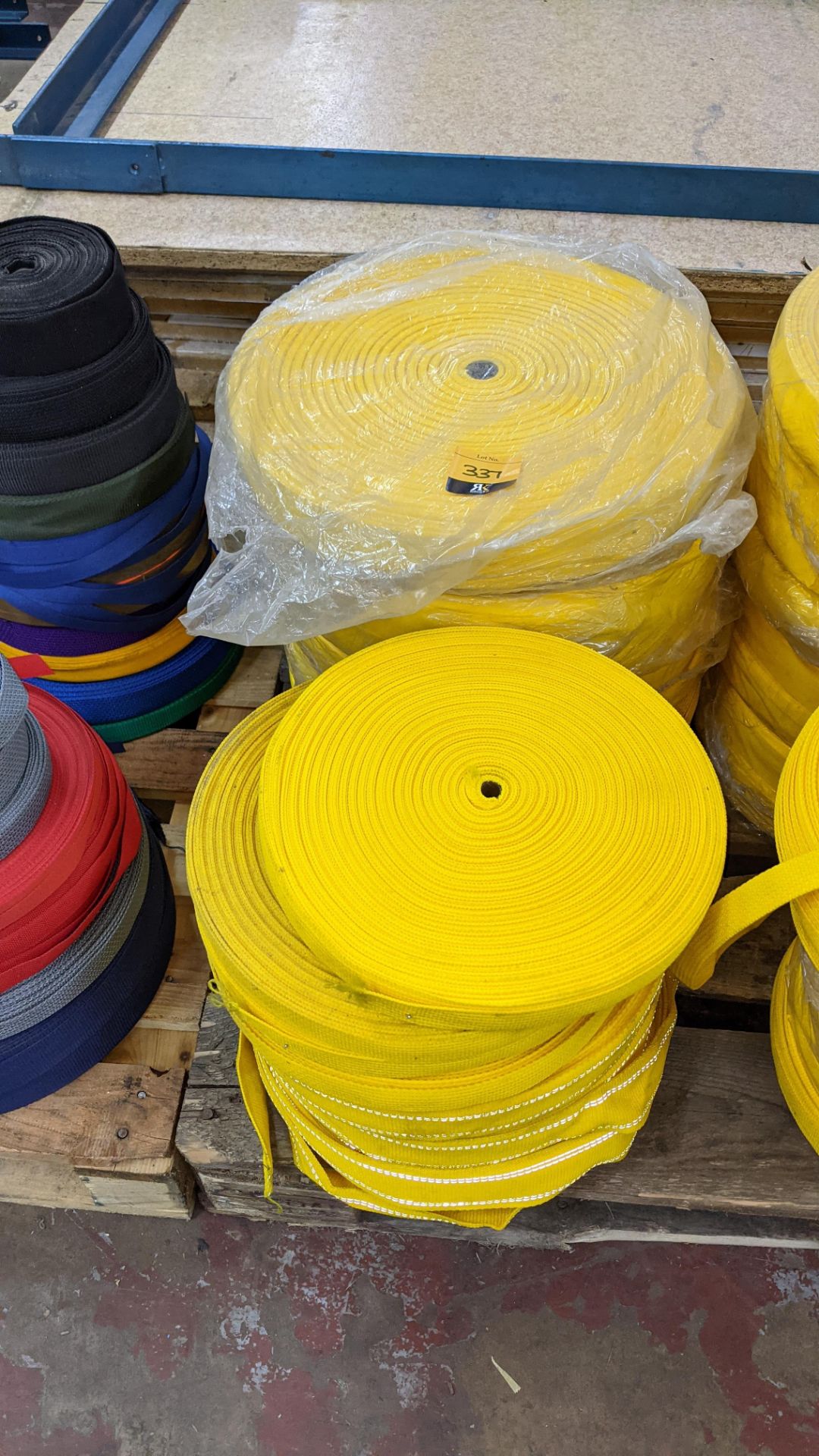 Quantity of reels of what is assumed to be belt fabric, in yellow, in 6 stacks - Image 3 of 5