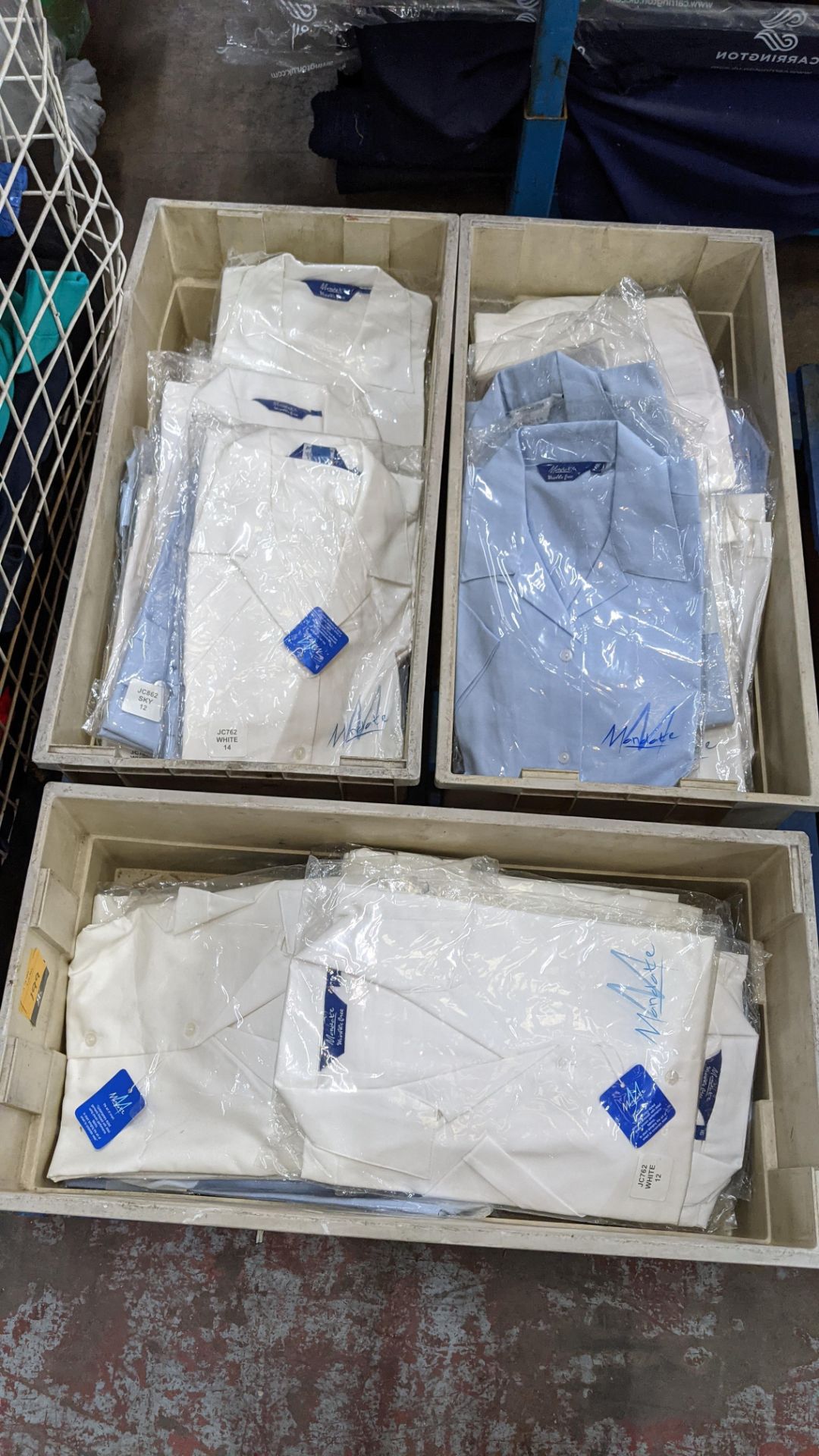 Approx 50 off assorted pale blue & white short sleeve button up tops by Mandate & The Co-op - this l