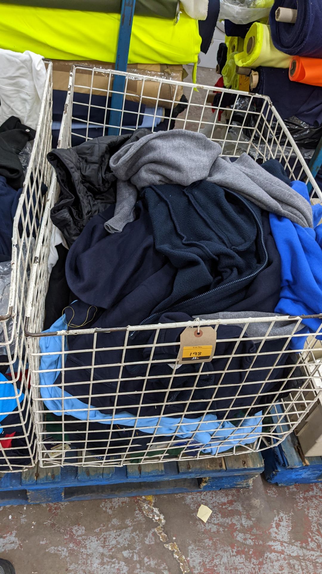 The contents of a cage of assorted adults garments. NB cage excluded