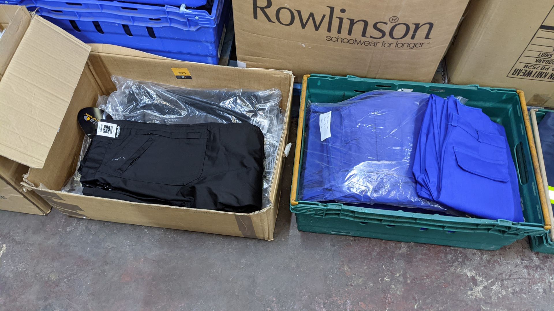 Quantity of black & blue trousers comprising the contents of 1 box & 1 crate