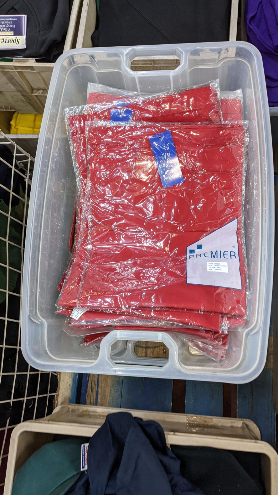 Approx 60 off red aprons - the contents of 2 crates. NB crates excluded - Image 5 of 6