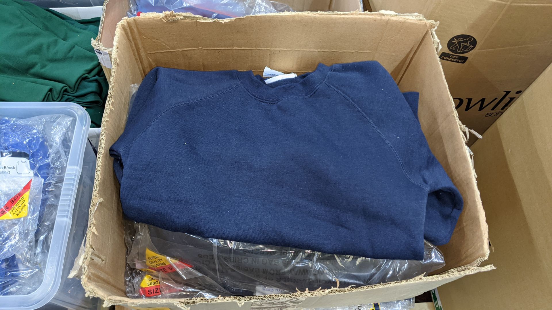 Approx 50 off navy children's sweatshirts - the contents of 1 large crate & 1 large box. NB crate e - Image 3 of 6