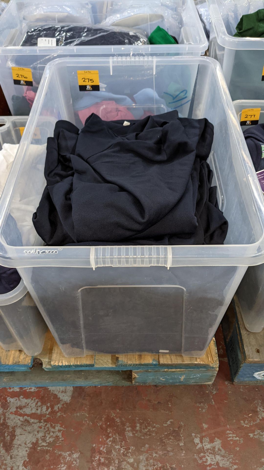 Approx 40 off blue polo shirts - the contents of 1 large crate. NB crate excluded