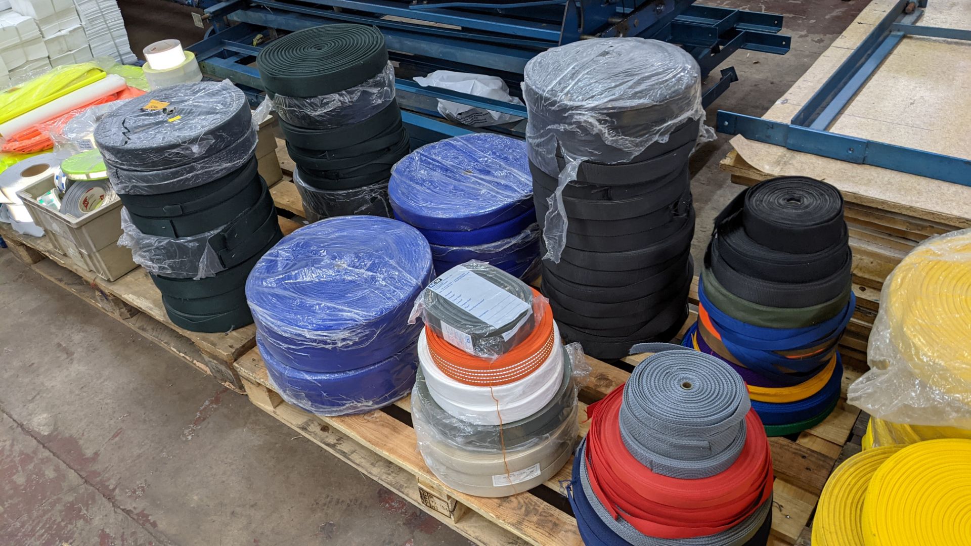 Quantity of reels of what is assumed to be belt fabric, in a variety of colours, in 8 stacks - Image 7 of 7