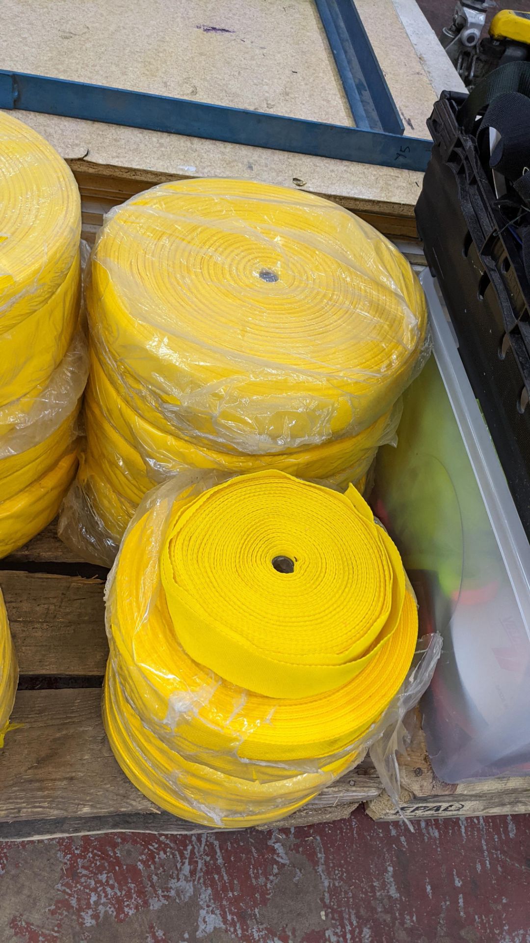 Quantity of reels of what is assumed to be belt fabric, in yellow, in 6 stacks - Image 5 of 5