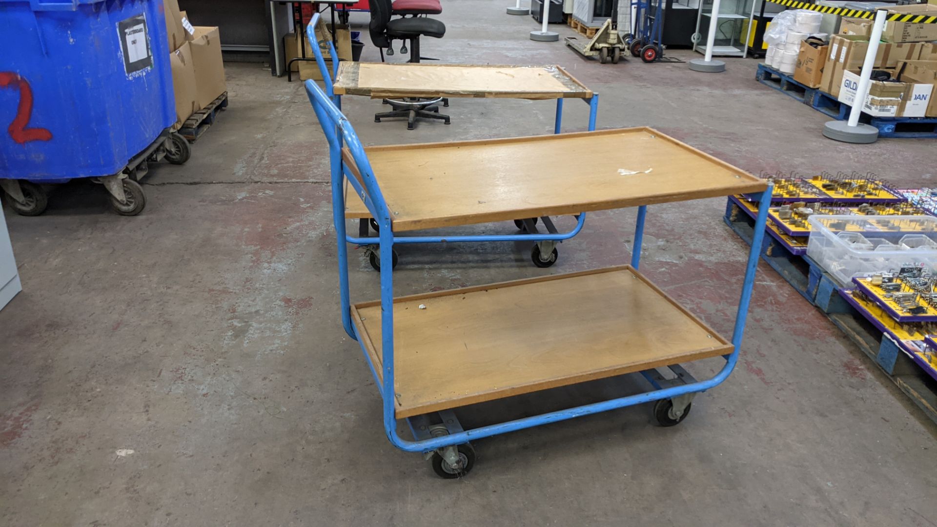 2 mobile twin shelf trolleys with lockable wheels