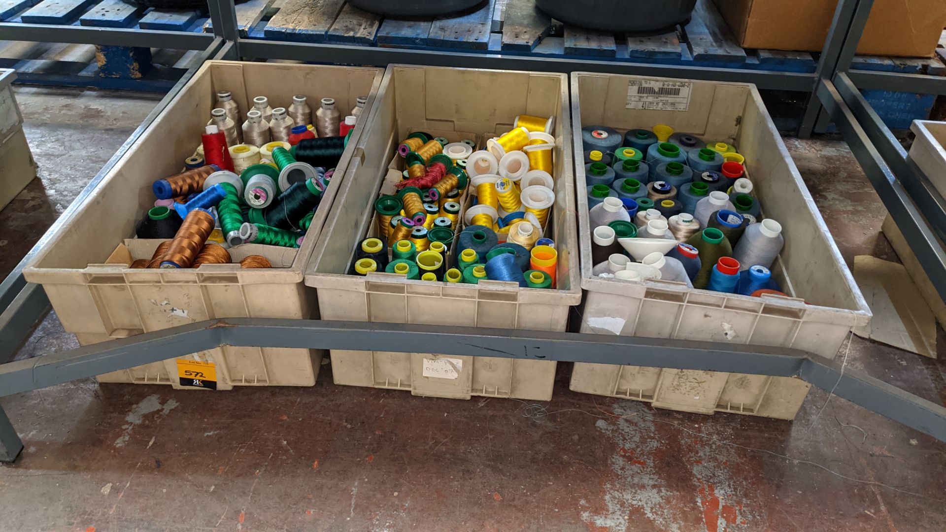 The contents of 3 large crates of assorted embroidery thread