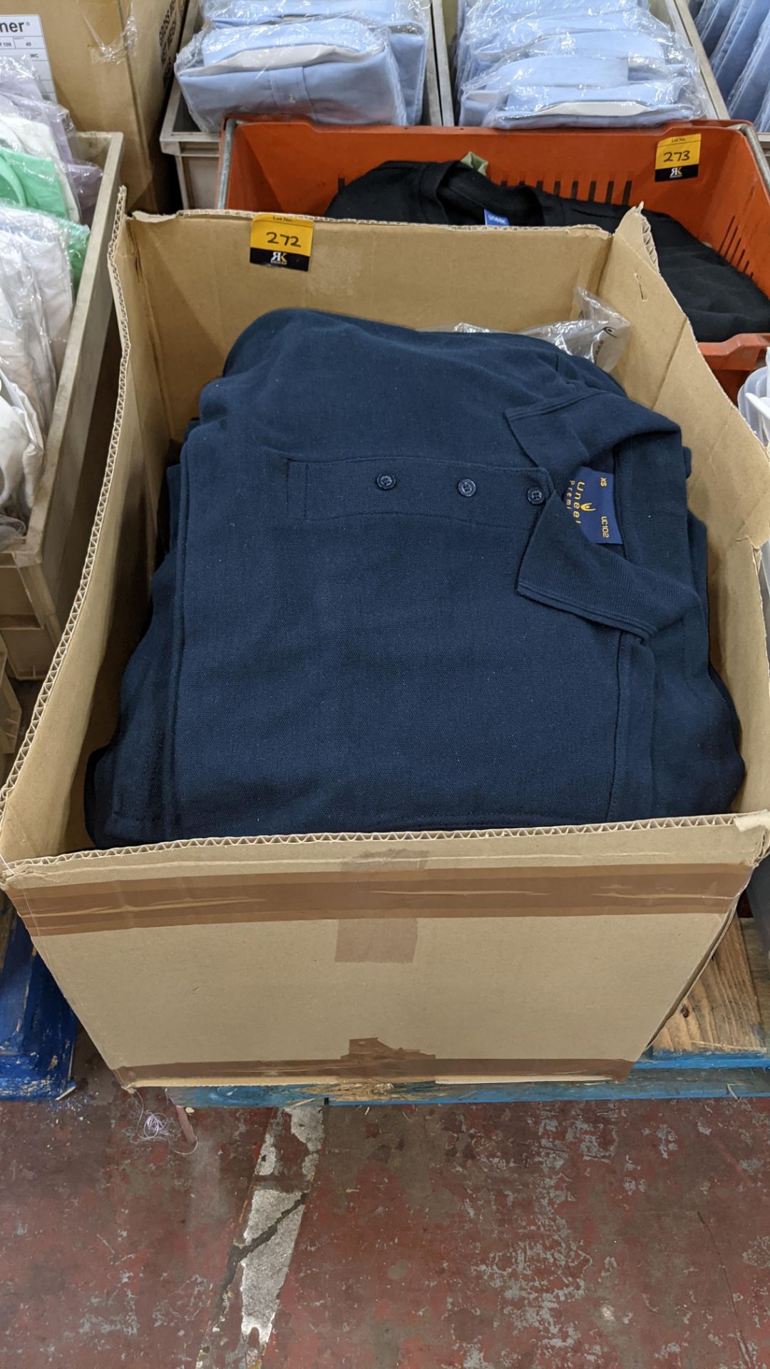 Quantity of Uneek blue polo shirts - the contents of 1 large box