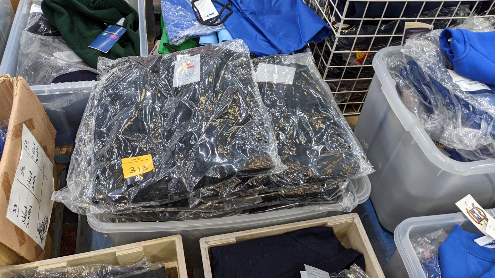 Approx 14 off black children's V neck jumpers & button up tops - the contents of 1 crate. NB crate