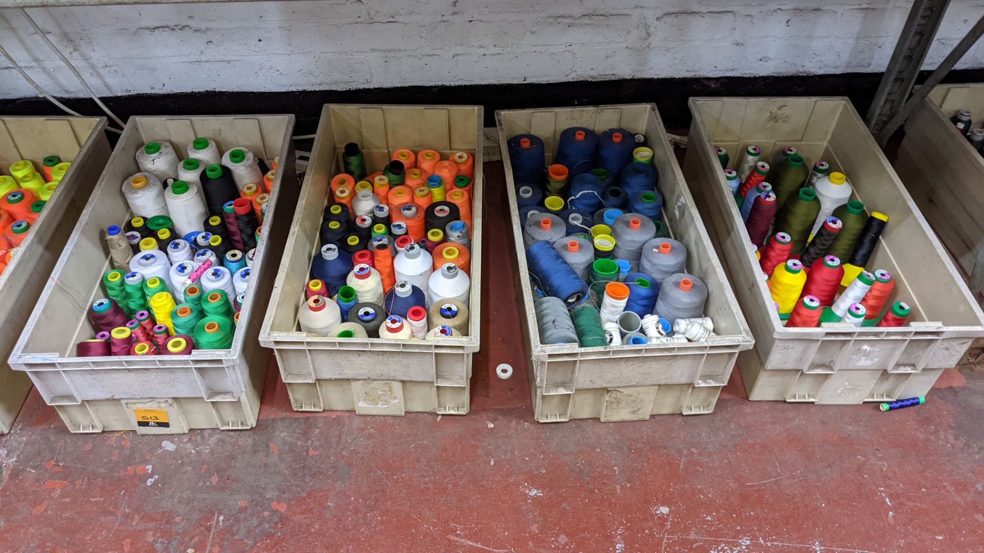 The contents of 4 large crates of assorted thread