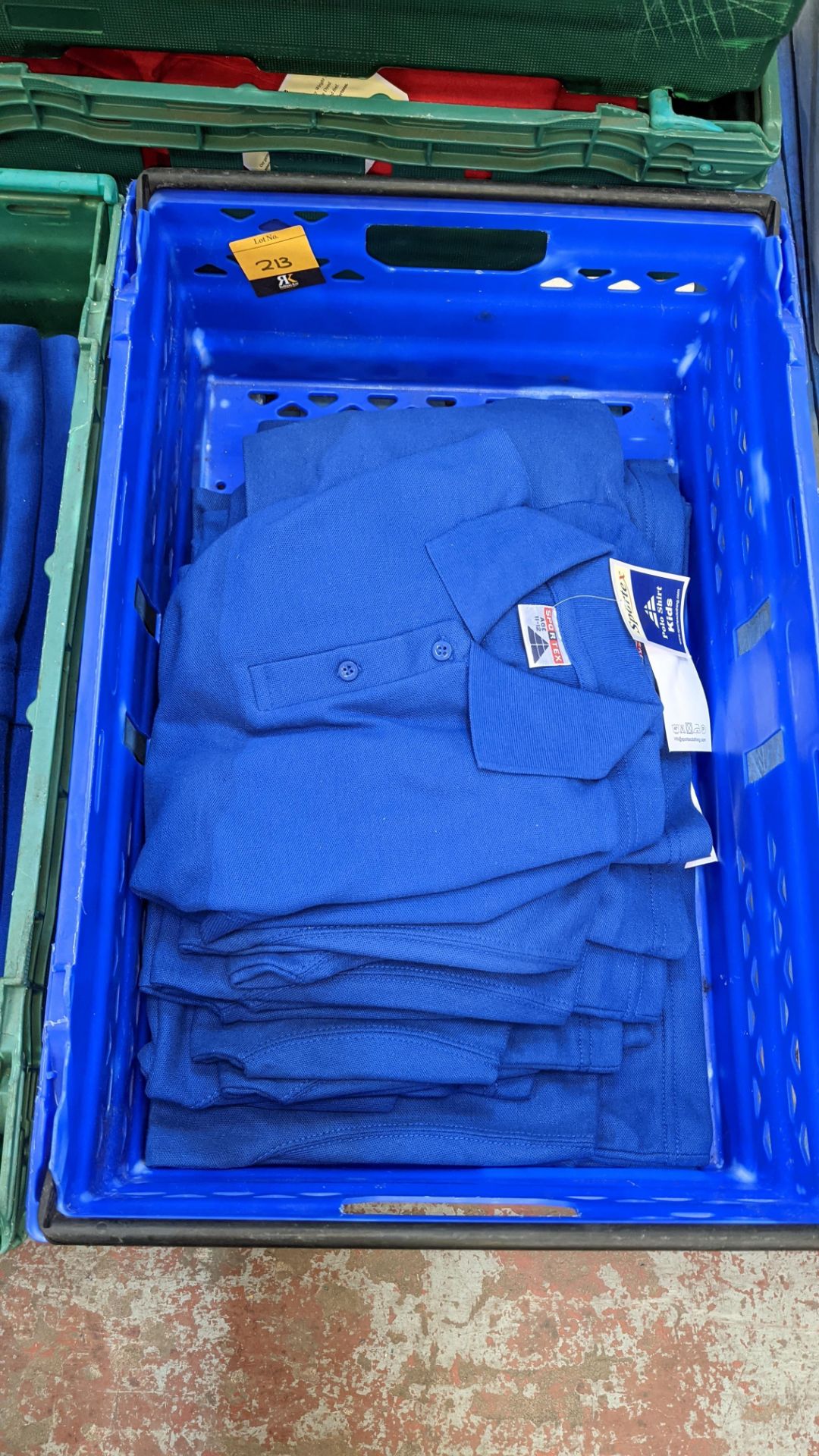 Approx 12 off Sportex children's blue polo shirts - the contents of 1 crate. NB crate excluded