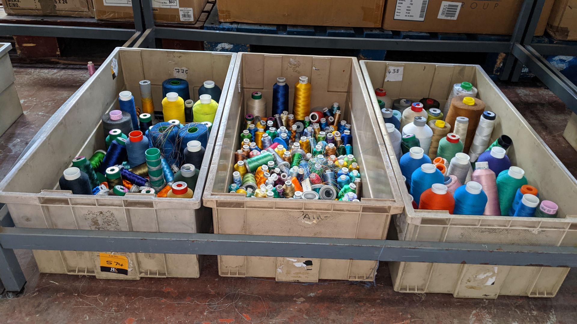 The contents of 3 large crates of assorted embroidery thread