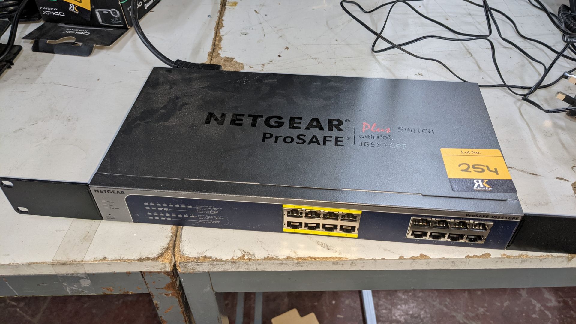 Netgear Prosafe Plus switch with PoE model JGS516PE. Includes optional rack mounting ears