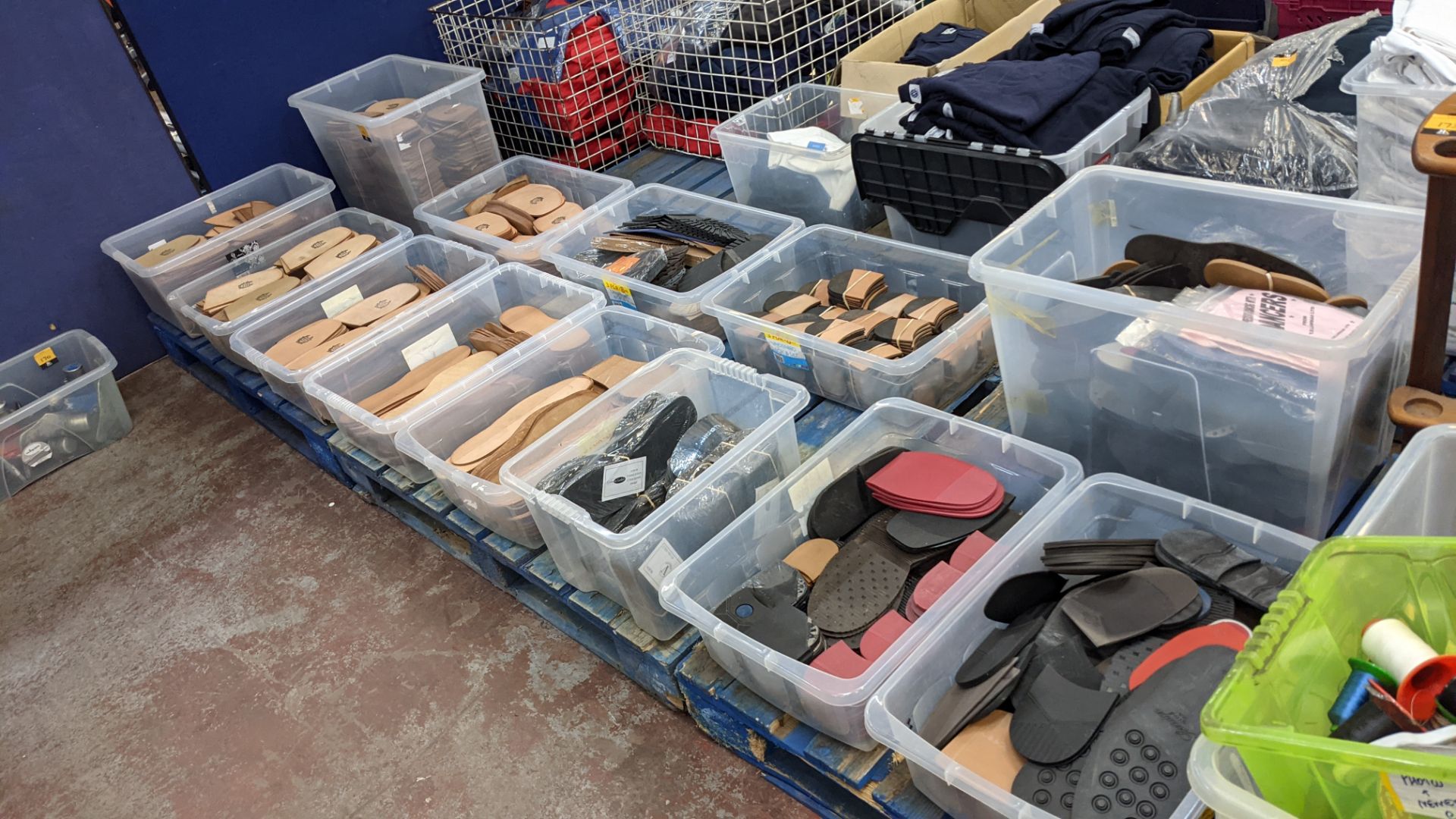 The contents of 13 crates of leather & rubber shoe soles & heels - crates excluded